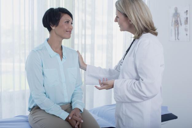 woman in menopause with practitioner